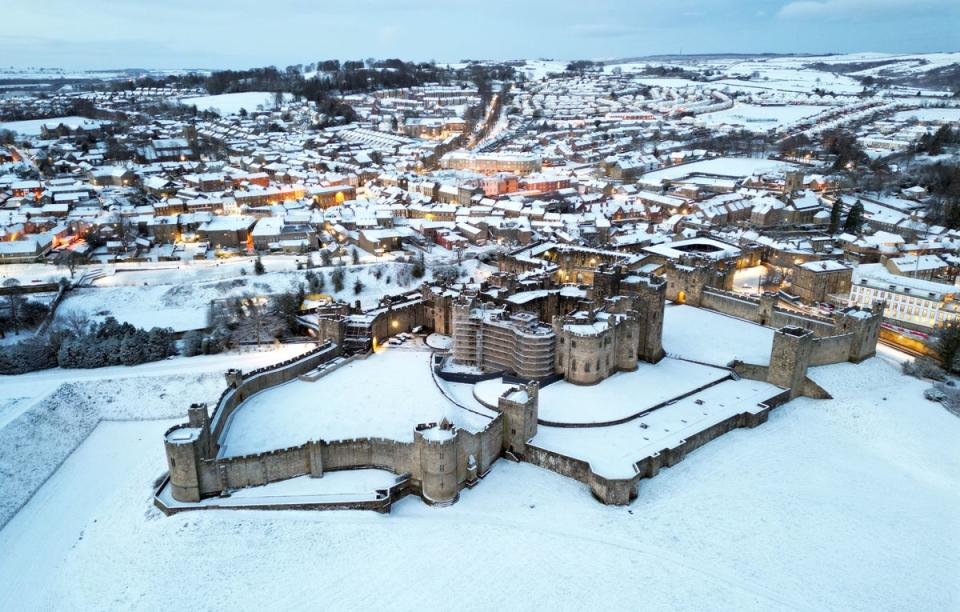 Snow covered fields surround Alnwick Castle in Northumberland as weather warnings are in place across all four nations (Owen Humphreys/PA Wire)