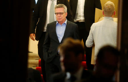 German Interior Minister Thomas de Maiziere of the Christian Democratic Union (CDU) leaves the German Parliamentary Society after exploratory talks about forming a new coalition government in Berlin, Germany, November 17, 2017. REUTERS/Hannibal Hanschke
