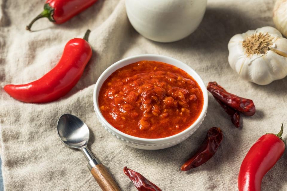 Red chili paste in white bowl.