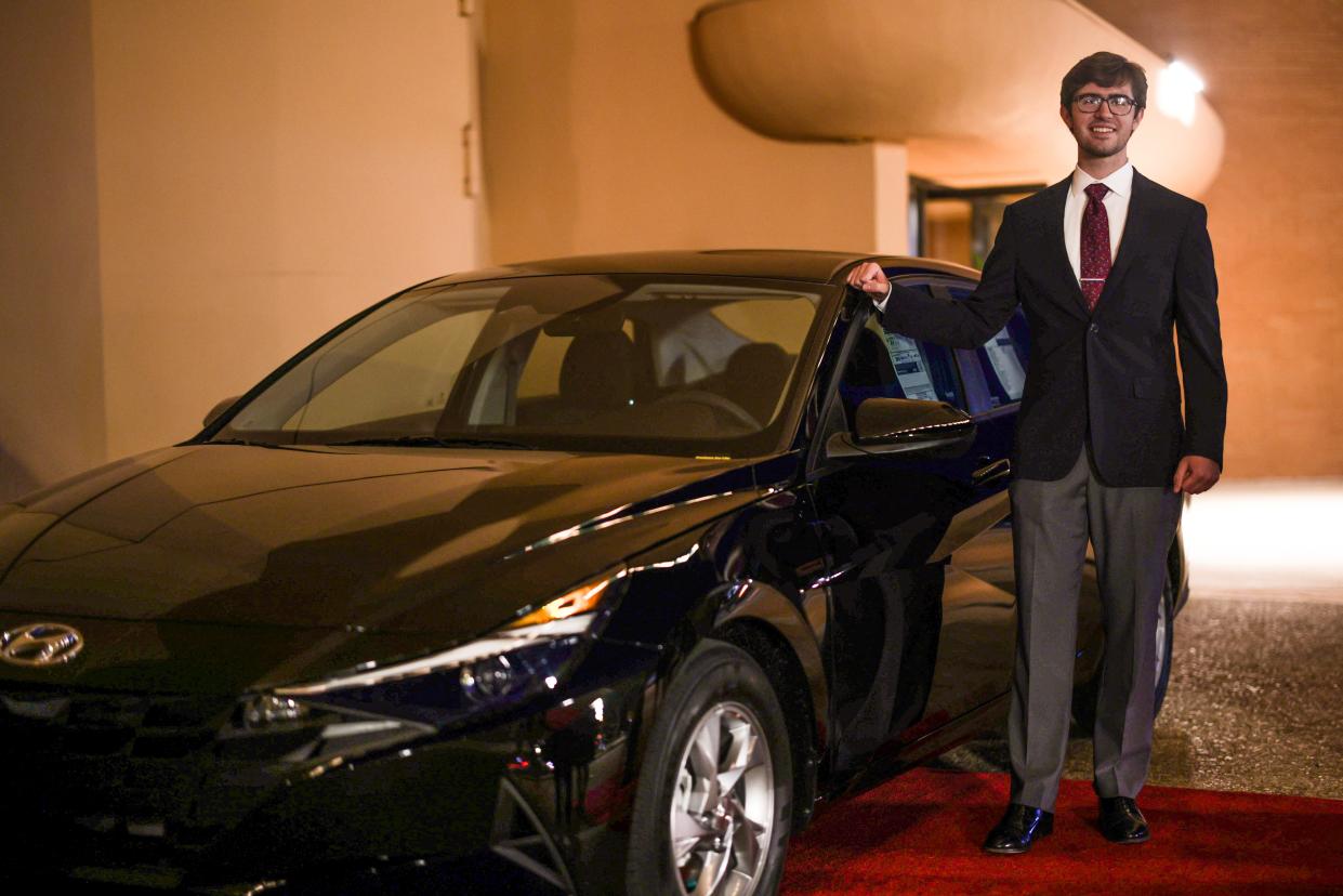 Night of Scholars winner Matt Fries poses with his brand new Hyundai Elantra.