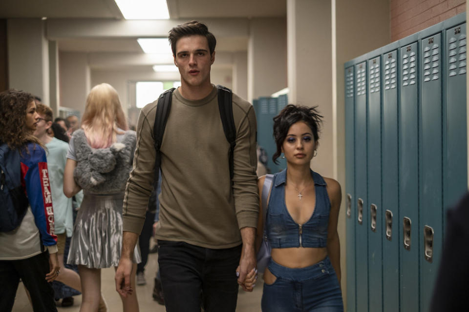 "Euphoria" characters Nate and Maddy walking down the school hallway holding hands