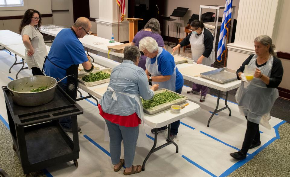 Volunteers prepare spanakopita for the Memphis Greek Festival on Saturday, March, 2022, at at Annunciation Greek Orthodox Church in Memphis. The festival runs May 20-21, but food preparation began in January. 