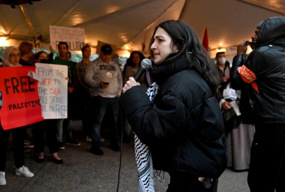 Roua Daas talks to the crowd gathered to support Palestine at the Allen Street gates on Thursday, Oct. 12, 2023. Abby Drey/adrey@centredaily.com