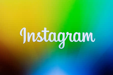 FILE PHOTO: A screen displays the Instagram logo during a presentation in New York December 12, 2013. REUTERS/Lucas Jackson/File Photo