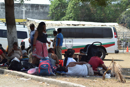 Migrants from Central America, waiting to begin their process to get their humanitarian visas to cross the country on their way to the United States, are seen outside an improvised shelter in Mapastepec, in Chiapas state, Mexico April 3, 2019. REUTERS/Jose Torres