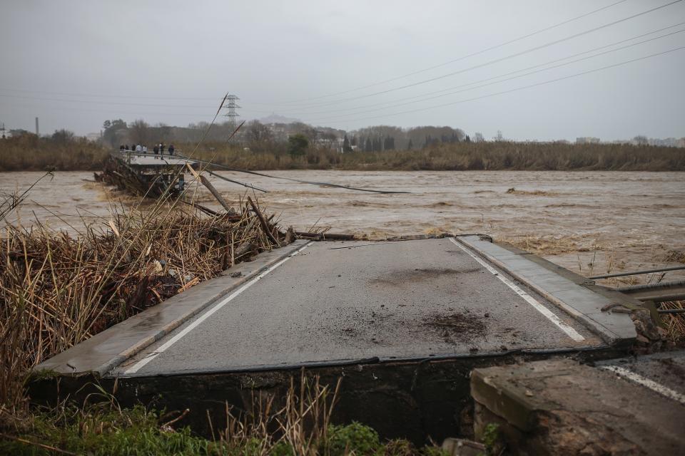 View of a collapsed bridge due heavy storms in Malgrat, near Barcelona, Spain, Wednesday, Jan. 22, 2020. Since Sunday the storm has hit mostly eastern areas of Spain with hail, heavy snow and high winds, while huge waves smashed into towns on the Mediterranean coast and nearby islands of Mallorca and Menorca. (AP Photo/Joan Mateu)