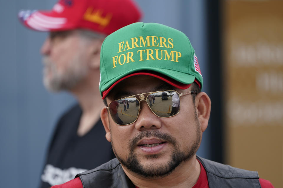 A supporter waits to enter a commit to caucus rally for former President Donald Trump, Wednesday, Sept. 20, 2023, in Maquoketa, Iowa. (AP Photo/Charlie Neibergall)