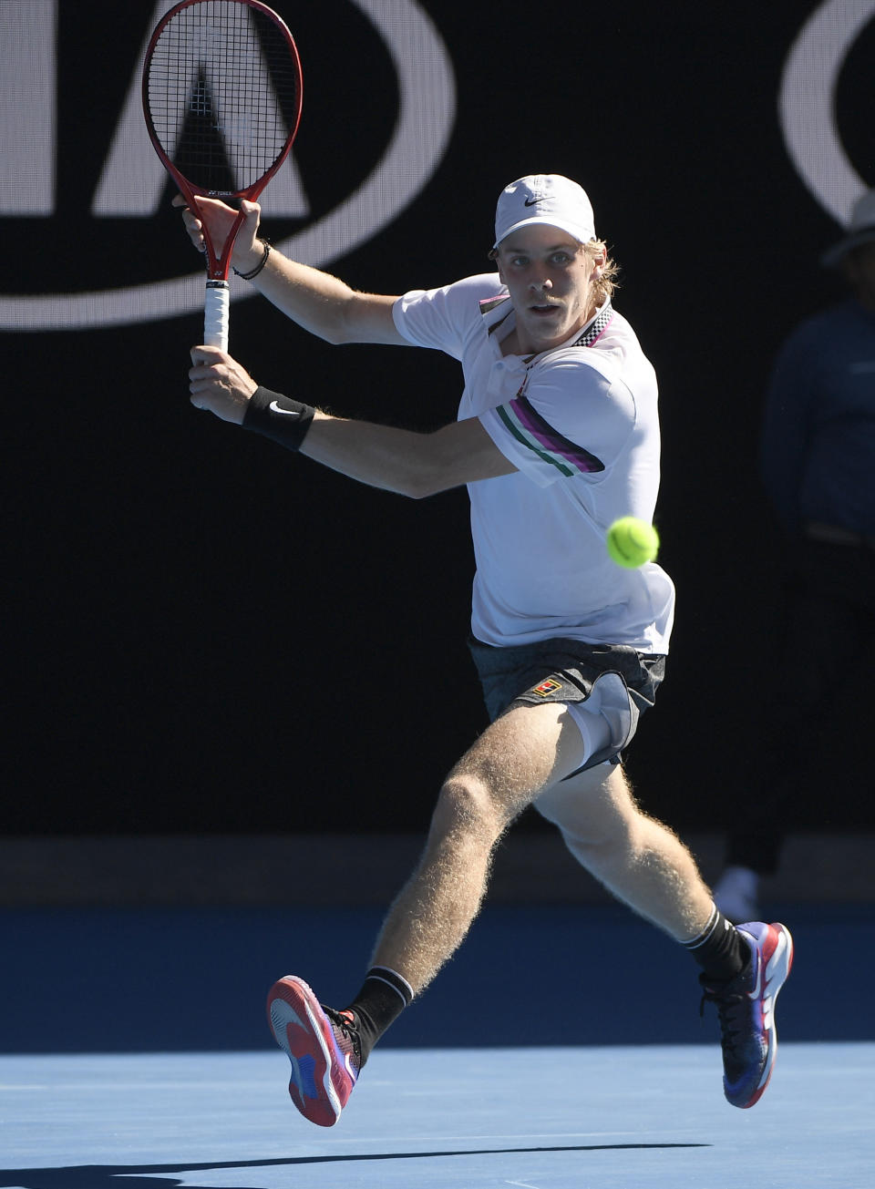 Canada's Denis Shapovalov makes a backhand return to Serbia's Novak Djokovic during their third round match at the Australian Open tennis championships in Melbourne, Australia, Saturday, Jan. 19, 2019. (AP Photo/Andy Brownbill)