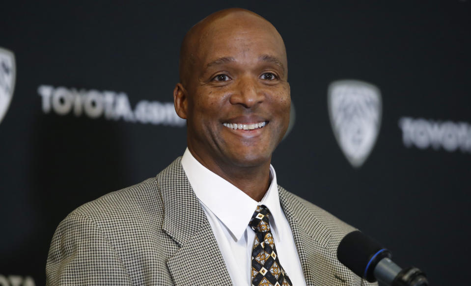 Karl Dorrell smiles during a news conference to announce that he is the new NCAA college head football coach at Colorado during a news conference Monday, Feb. 24, 2020, in Boulder, Colo. (AP Photo/David Zalubowski)