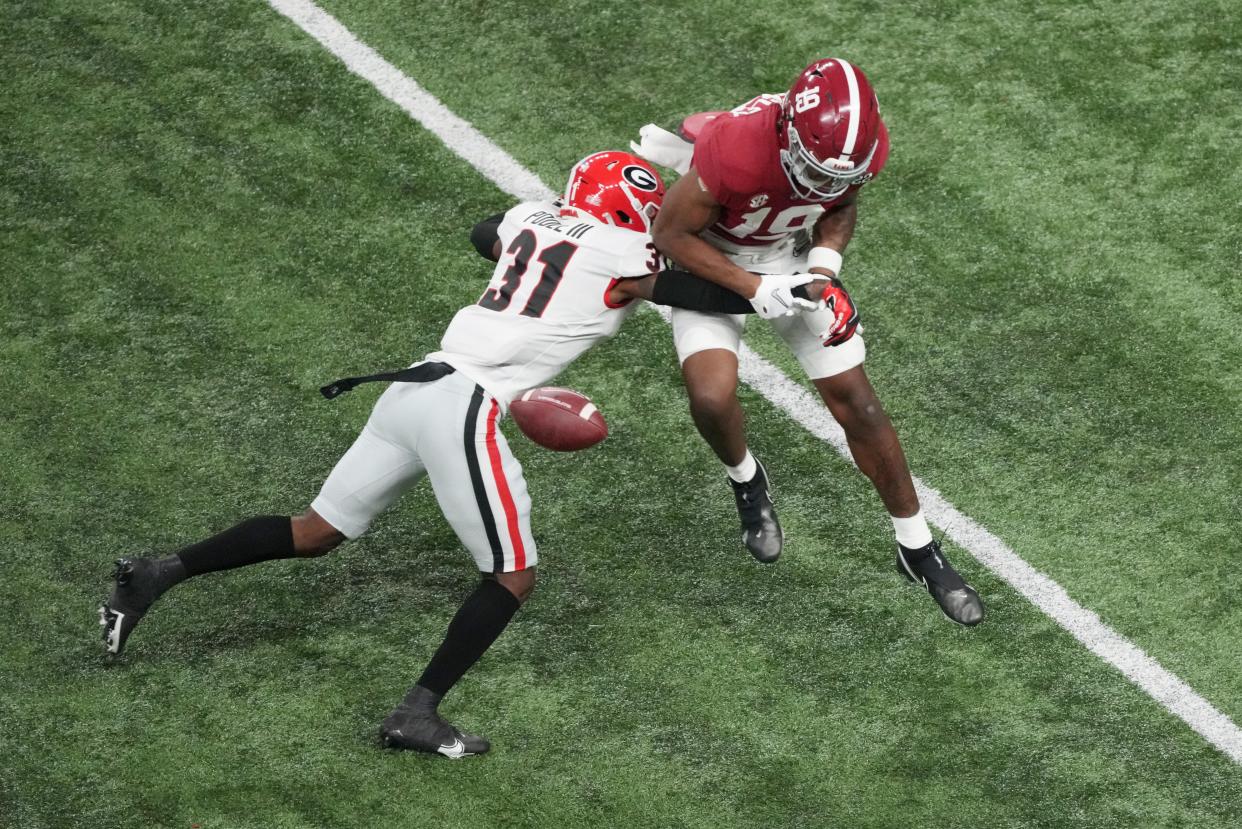 Jan 10, 2022; Indianapolis, IN, USA; Georgia defensive back William Poole (31) breaks up a pass to  Alabama Crimson Tide tight end Jahleel Billingsley (19) in the first quarter during the 2022 CFP college football national championship game at Lucas Oil Stadium. Joshua Bickel-USA TODAY Sports