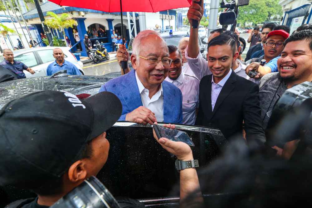 Former prime minister Datuk Seri Najib Razak speaks to reporters after giving his statement to the police at Bukit Aman October 18, 2019. ― Picture by Firdaus Latif