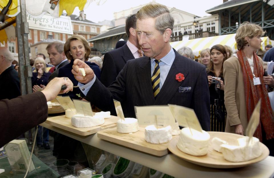 King Charles visits a cheese stall during The Food Lovers' Fair in November 2001.