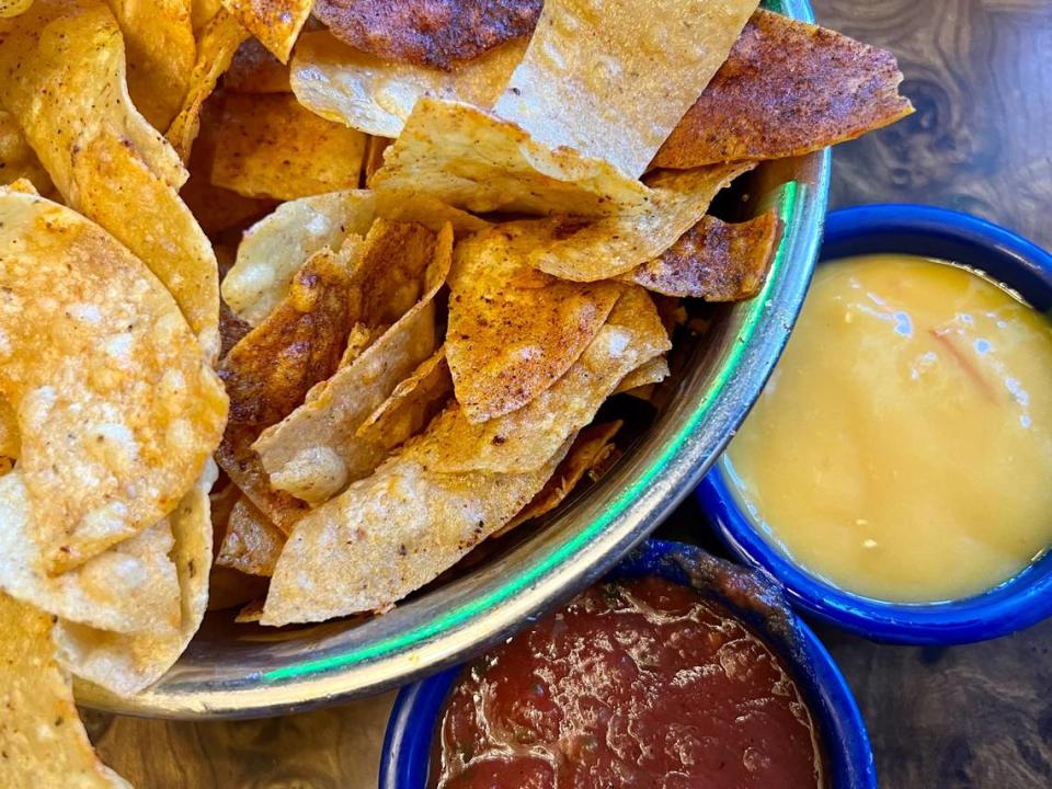 Chile powder-dusted chips, hot sauce and cheese sauce at Campo Verde Sept. 9, 2023.