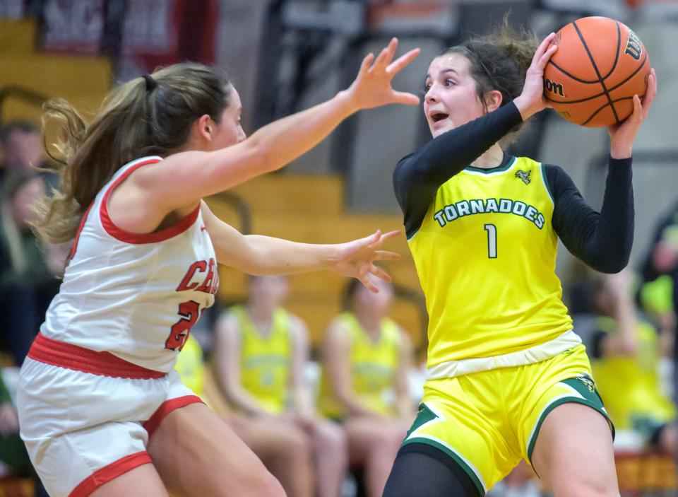 Abingdon-Avon's Kennedy Quinn, right, looks to pass to a teammate as the Tornadoes battle Dee-Mack in the first half of their nonconference basketball game Thursday, Feb. 1, 2024 at Dee-Mack High School. The Chiefs routed the Tornadoes 60-31.