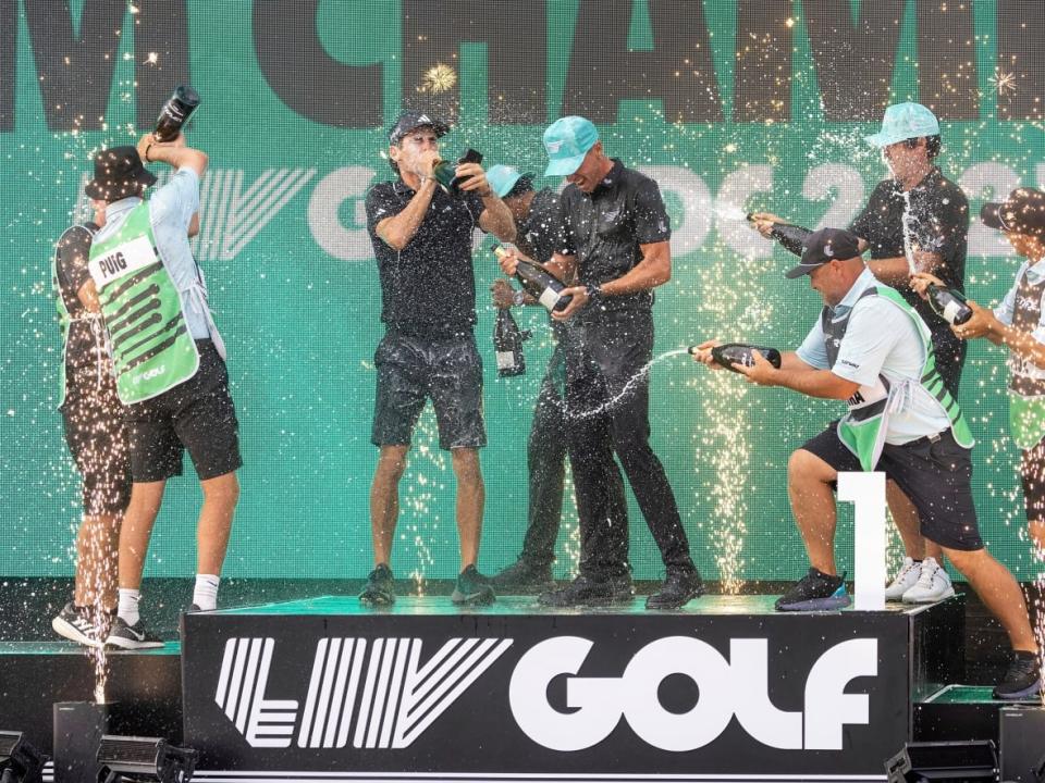 Liv team champions celebrate during an event in May. The Saudi-funded breakaway tour and supposed rival PGA Tour announced a merger on Tuesday, potentially leaving the upcoming Canadian Open overshadowed. (Chris Trotman/LIV Golf via The Associated Press - image credit)