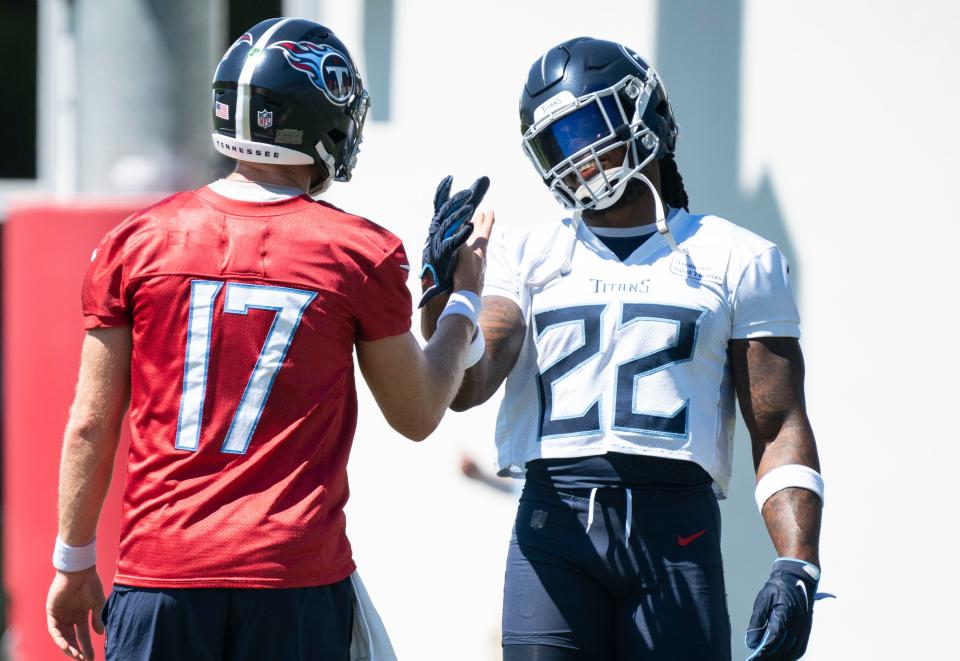 Tennessee Titans quarterback Ryan Tannehill (17) and running back Derrick Henry (22) greet each other at the start of practice at Ascension Saint Thomas Sports Park Thursday, Sept. 8, 2022, in Nashville, Tenn. 