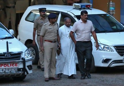 Bishop Franco Mulakkal (2nd R), accused of raping a nun, is pictured outside a crime branch office on the outskirts of Kochi in the southern state of Kerala, India, September 19, 2018. REUTERS/Sivaram V