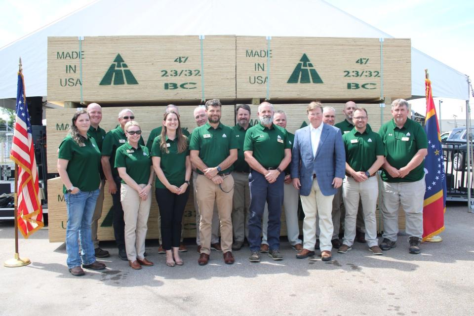 Hood Industries breaks ground on a $200 million laminated plywood facility in Beaumont, Miss., Thursday, May 4, 2023. The former plywood plant was destroyed by a tornado in April 2022. Pictured with Hood employees is Gov. Tate Reeves, front row right.