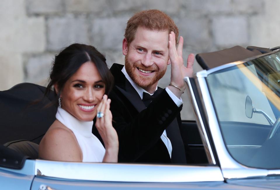 Their big day including an <a rel="nofollow noopener" href="https://people.com/royals/prince-harry-meghan-markle-royal-wedding-reception/" target="_blank" data-ylk="slk:evening reception;elm:context_link;itc:0;sec:content-canvas" class="link ">evening reception</a>, which the newlyweds headed to in style: after an <a rel="nofollow noopener" href="https://people.com/royals/prince-harry-meghan-markle-frogmore-house-evening-reception/" target="_blank" data-ylk="slk:outfit change;elm:context_link;itc:0;sec:content-canvas" class="link ">outfit change</a>, they drove off in a blue Jaguar. 