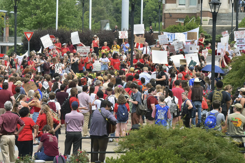 Students gather during a walkout in protest of an administration proposal to cut 9% of majors and amid a $45 million budget shortfall at West Virginia University in Morgantown, W.Va., Monday, Aug. 21, 2023. (Ron Rittenhouse /The Dominion-Post via AP)