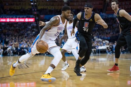 Dec 15, 2018; Oklahoma City, OK, USA; Oklahoma City Thunder forward Paul George (13) dribbles past LA Clippers forward Tobias Harris (34) during the third quarter at Chesapeake Energy Arena. Mandatory Credit: Rob Ferguson-USA TODAY Sports