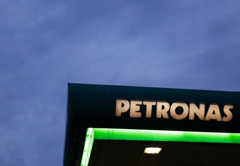 A logo of a Petronas fuel station is seen against a darkening sky in Kuala Lumpur February 10, 2016. — Reuters pic