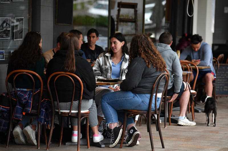 Diners sit a a cafe following 108 days of lockdown at Bronte in Sydney.