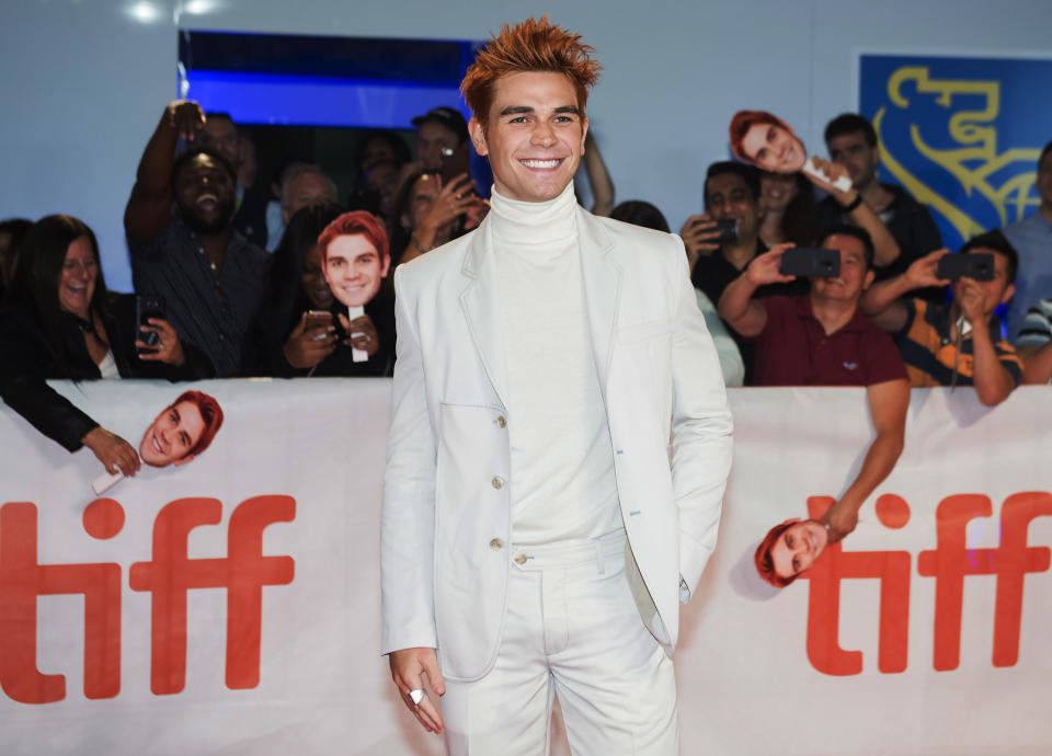 Actor KJ Apa poses for photographs on the red carpet after arriving for the new movie "The Hate U Give" during the 2018 Toronto International Film Festival in Toronto on Friday, Sept. 7, 2018. (Nathan Denette/The Canadian Press via AP)