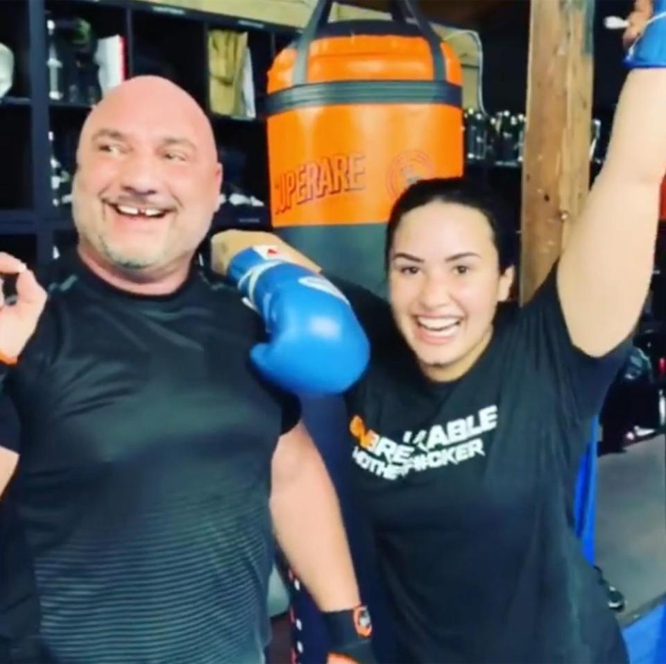 Demi Lovato with her trainer