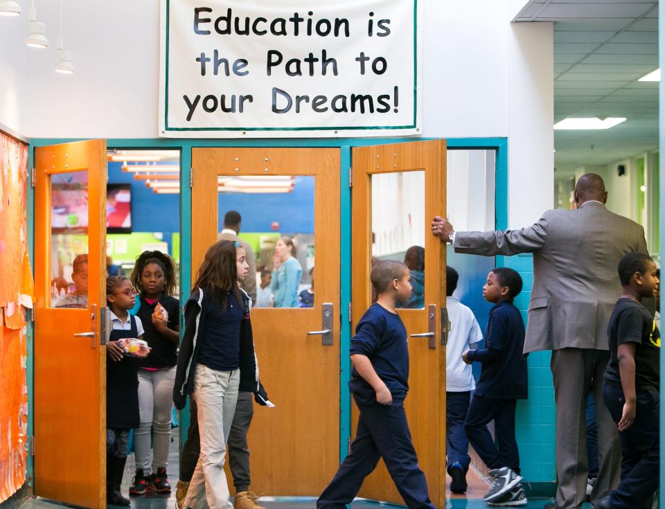 Principal Jeffers Brown holds the door as students arrive for their lunch at Stubbs Elementary School on Tuesday, Oct. 27, 2020.