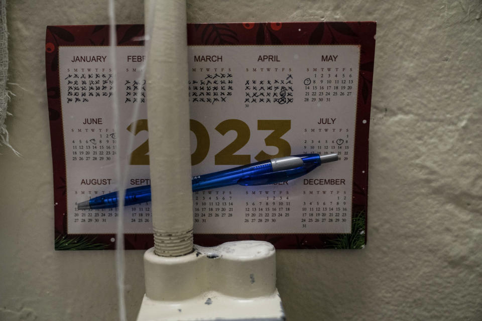 A small calendar is propped up behind a pipe in Gerald Massey's cell at Folsom State Prison in Folsom, Calif., Wednesday, May 3, 2023. Massey recently earned his bachelor's degree in communications. Many more prisoners like Massey will have opportunities to leave prison with bachelor's degrees, when new federal rules on financial aid for higher education take effect in July. (AP Photo/Jae C. Hong)