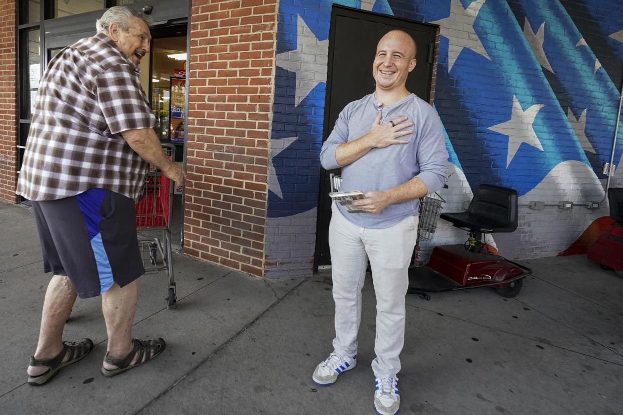 Max Rose, right, talks to a voter while campaigning on the Staten Island borough of New York, Saturday, Aug. 20, 2022.