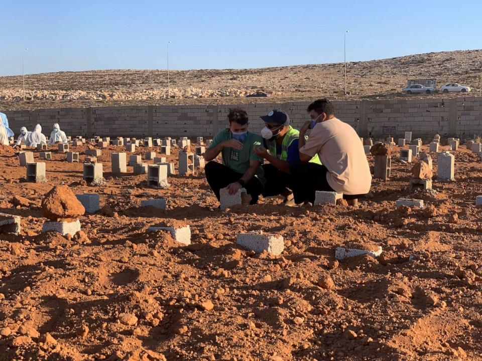 PHOTO: People pray at the graves of the flash flood victims in Derna, Libya, Friday, Sept. 15, 2023. (Yousef Murad/AP)