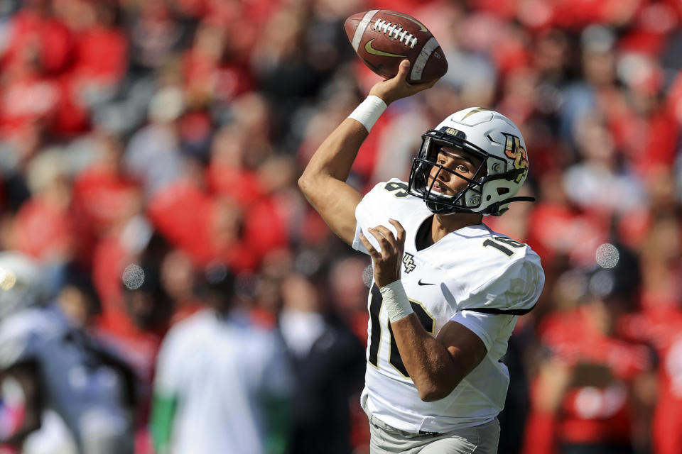 UCF quarterback Mikey Keene (16) throws a pass during the first half of an NCAA college football game against Cincinnati, Saturday, Oct. 16, 2021, in Cincinnati. (AP Photo/Aaron Doster)