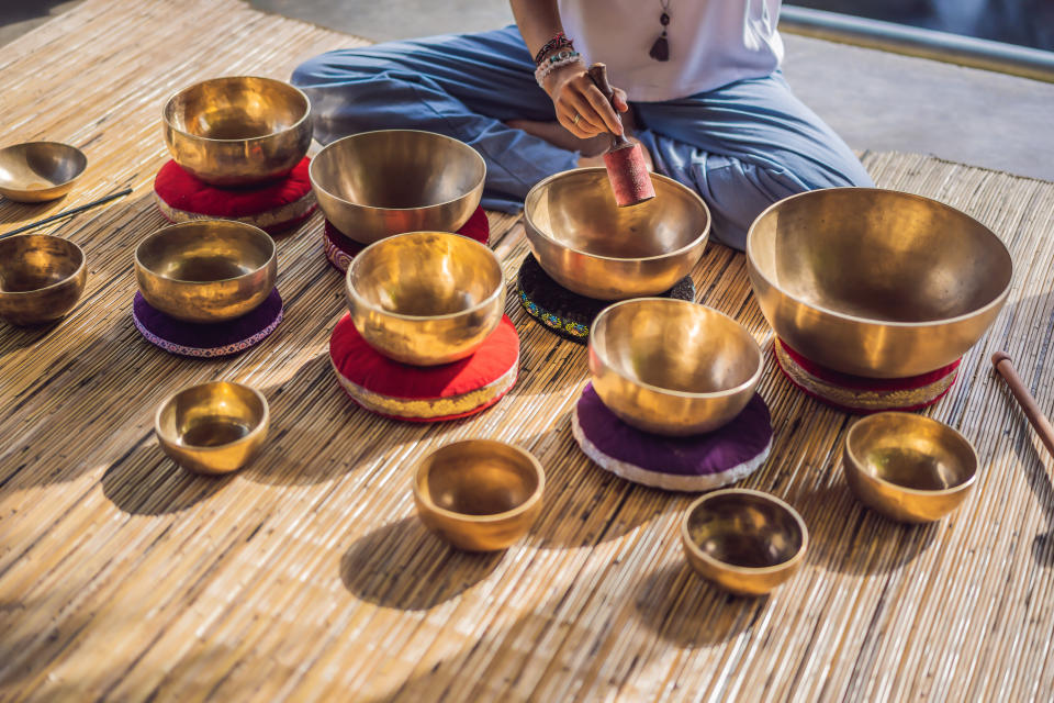 Tibetan singing bowls may be one of the sound methods used in a sound bath class. (Photo: galitskaya via Getty Images)