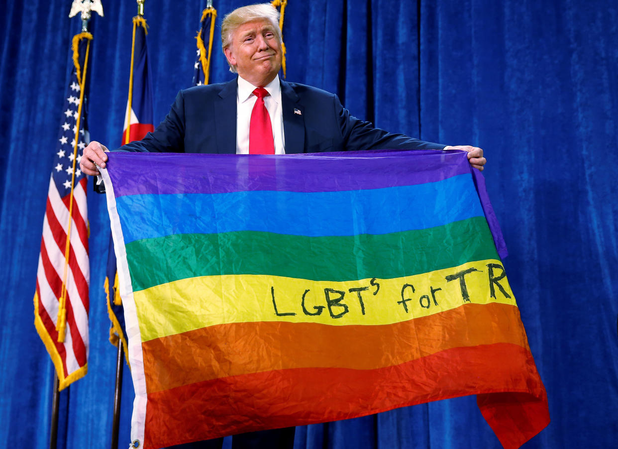 Despite waving a big gay flag, President Donald Trump hasn't turned out to be an advocate for LGBTQ rights with his judicial nominations. (Photo: Carlo Allegri / Reuters)