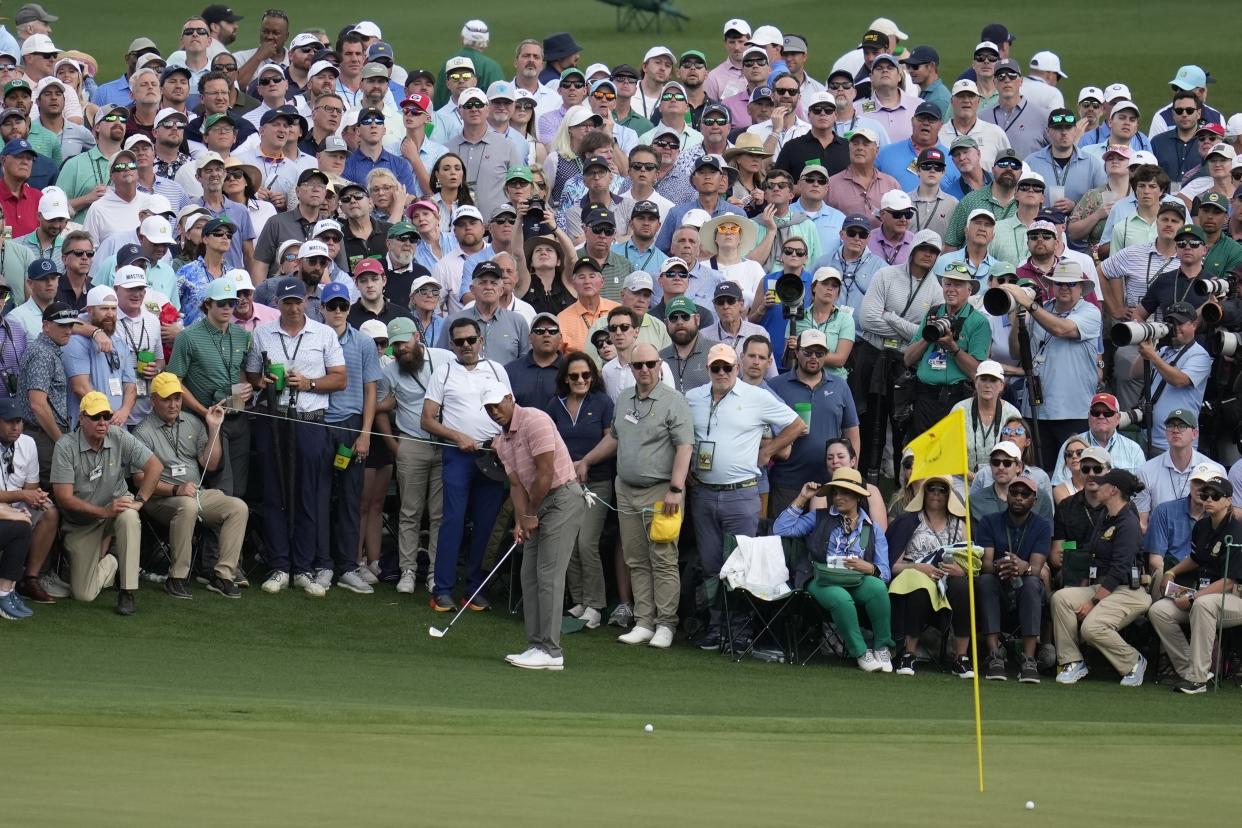 Tiger Woods chips to the green on the second hole during the first round at the Masters golf tournament at Augusta National Golf Club Thursday, April 11, 2024, in Augusta, Ga. (AP Photo/Ashley Landis)