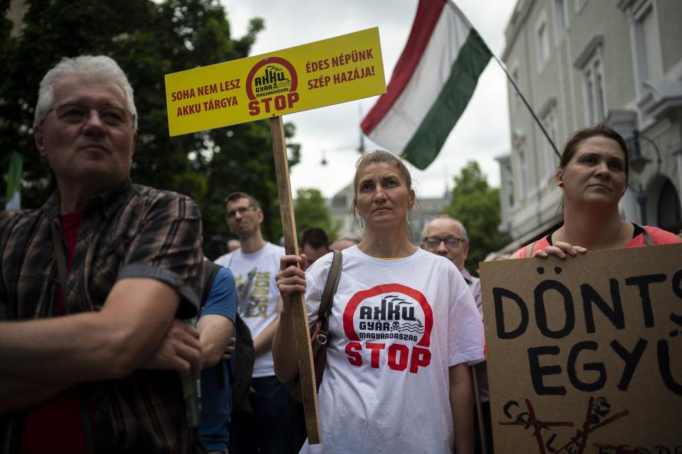 Residents gather in Debrecen, Hungary, during a demonstration against a factory that will produce batteries for electric vehicles built by a China-based company on Tuesday, May 23, 2023. Residents, environmentalists and opposition politicians are worried that a sprawling battery factory will exacerbate existing environmental problems and use up the country's precious water supplies. (AP Photo/Denes Erdos)