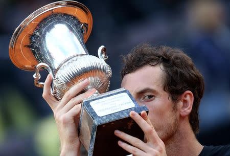 Tennis - Italy Open Men's Singles Final match - Novak Djokovic of Serbia v Andy Murray of Britain - Rome, Italy - 15/5/16 Murray kisses the trophy after winning the match. REUTERS/Alessandro Bianchi