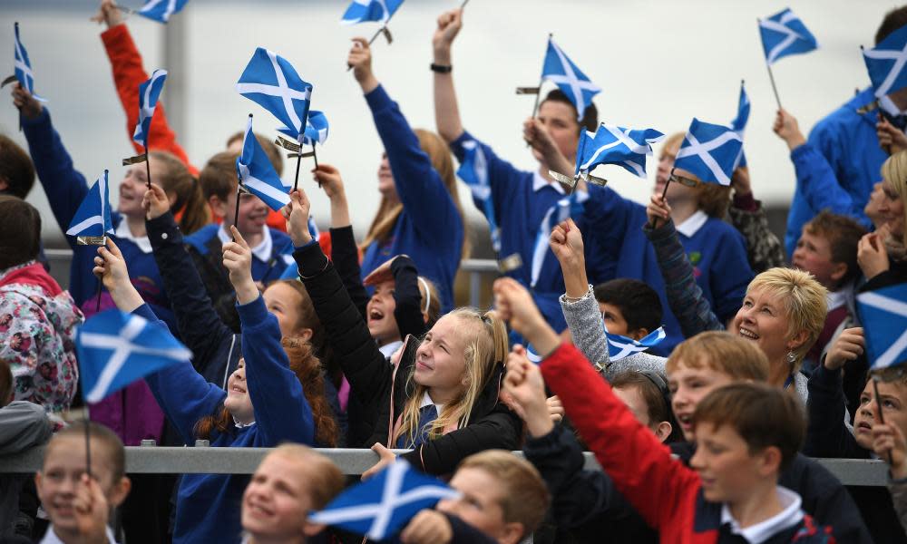 School children wave flags on the Queensferry Crossing before the arrival of Queen Elizabeth II