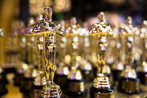 <span class="caption">Look a little closer, and these Oscars aren't all they appear to be...</span> <span class="attribution"><a class="link " href="https://www.shutterstock.com/image-photo/hollywood-ca-usa-july-26-2018-1178139049?src=thCXlfcJtagyzdUGYdCPag-1-16" rel="nofollow noopener" target="_blank" data-ylk="slk:Valeriya Zankovych/Shutterstock;elm:context_link;itc:0;sec:content-canvas">Valeriya Zankovych/Shutterstock</a></span>