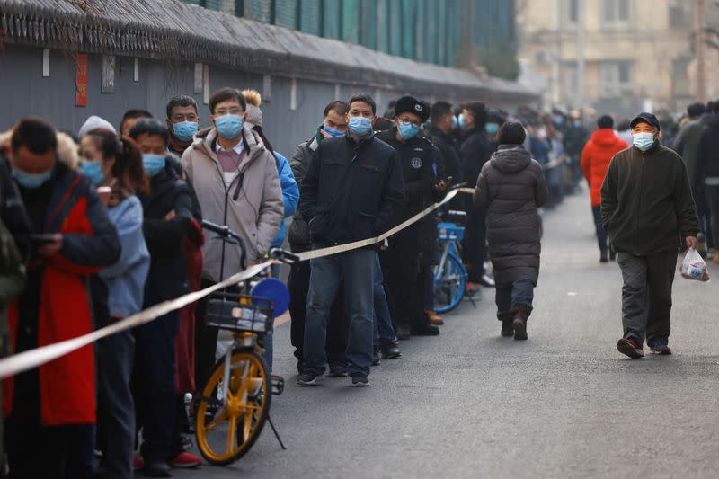 People line up to get their nucleic acid test following the outbreak of the coronavirus disease (COVID-19) in Beijing