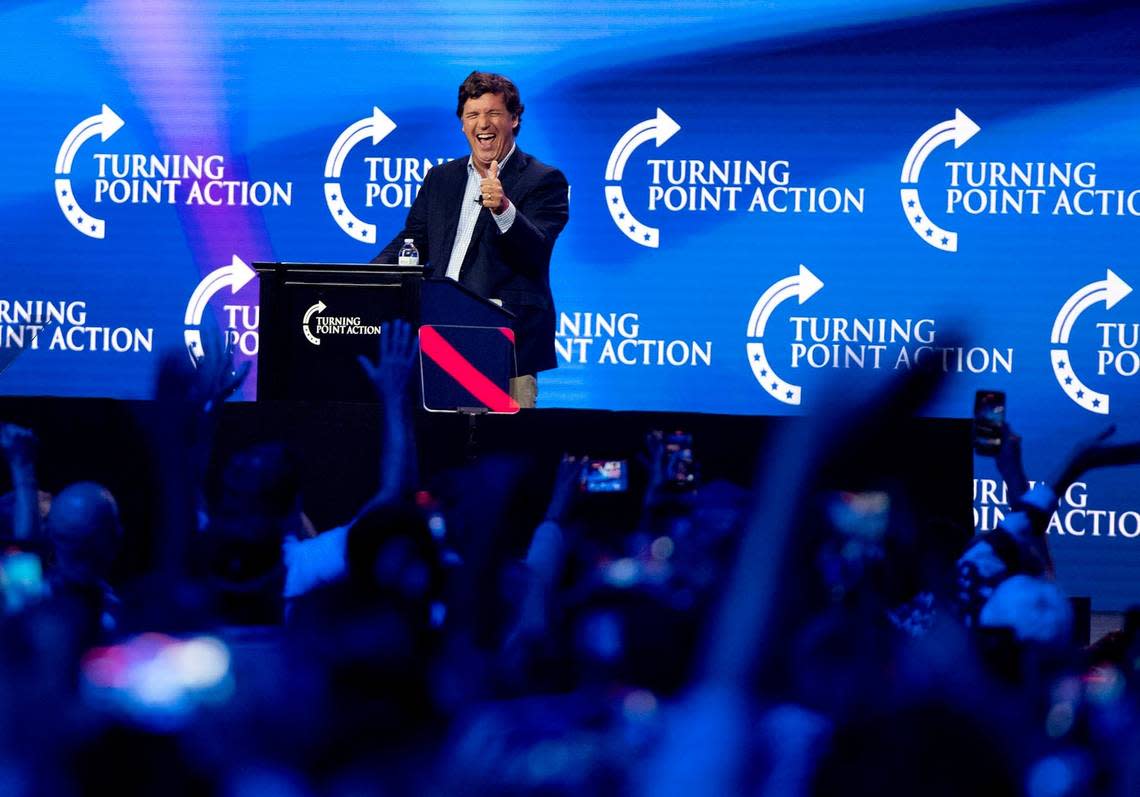 Tucker Carlson speaks during a Turning Point Action conference in July in Florida.