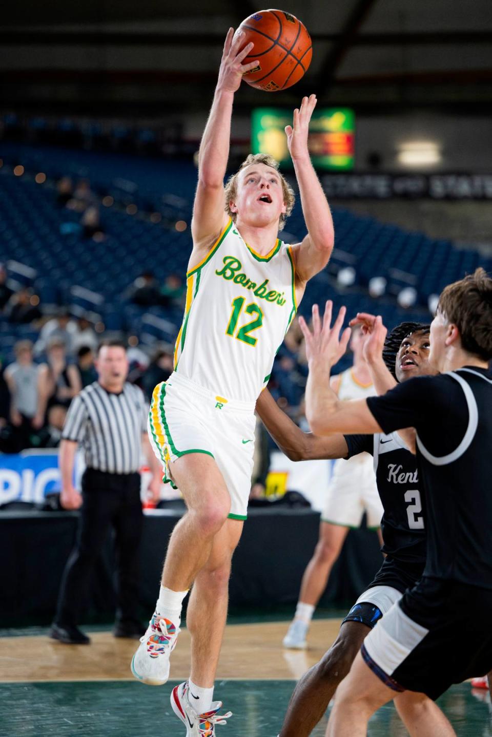 Richland’s Joshua Woodard (12) goes to the basket against Kentwood during the quarterfinals game of the Class 4A state tournament at the Tacoma Dome, on Thursday, Feb. 29, 2024, in Tacoma, Wash.