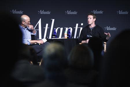Facebook CEO Mark Zuckerberg (R) takes his seat for an onstage interview with James Bennet (L) of the Atlantic Magazine in Washington, September 18, 2013. REUTERS/Jonathan Ernst