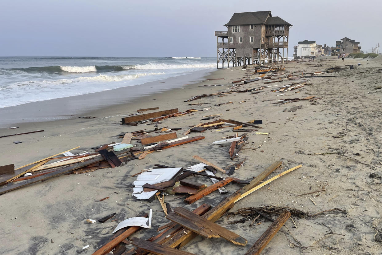 Debris from an unoccupied North Carolina beach house that collapsed into the Atlantic Ocean on Friday due to winds and waves caused by Hurricane Ernesto. 