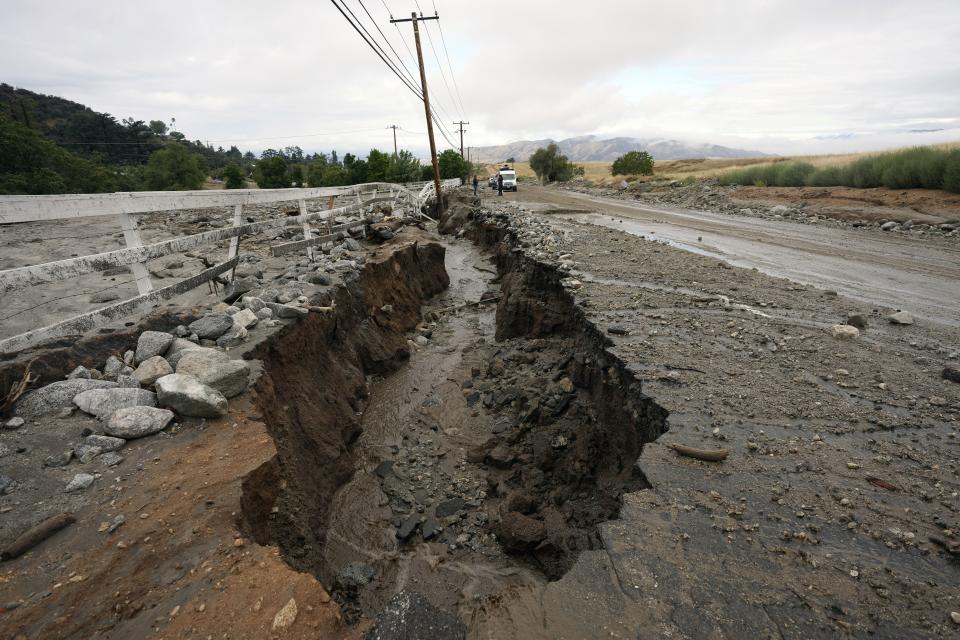 Mud and water flow through a crack off the side of the road in the aftermath of Tropical Storm Hilary, Monday, Aug. 21, 2023, in Yucaipa, Calif. | Marcio Jose Sanchez, Associated Press