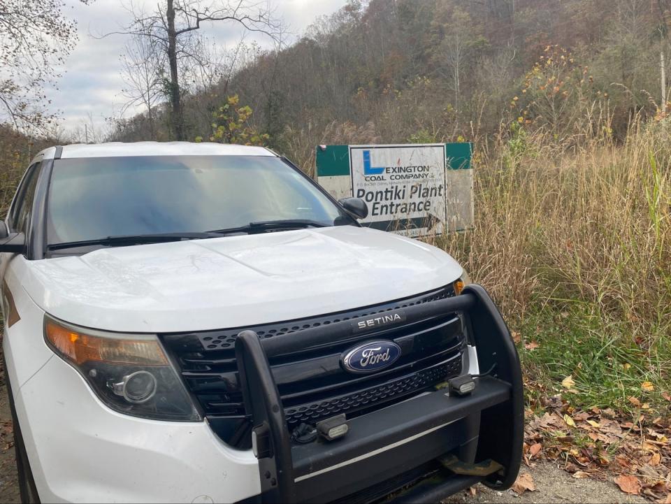 In this image provided by WCHS-TV, a Martin County, Ky., sheriff's cruiser is shown outside an abandoned mine coal preparation plant Wednesday, Nov. 1, 2023, south of Inez, Ky (AP)