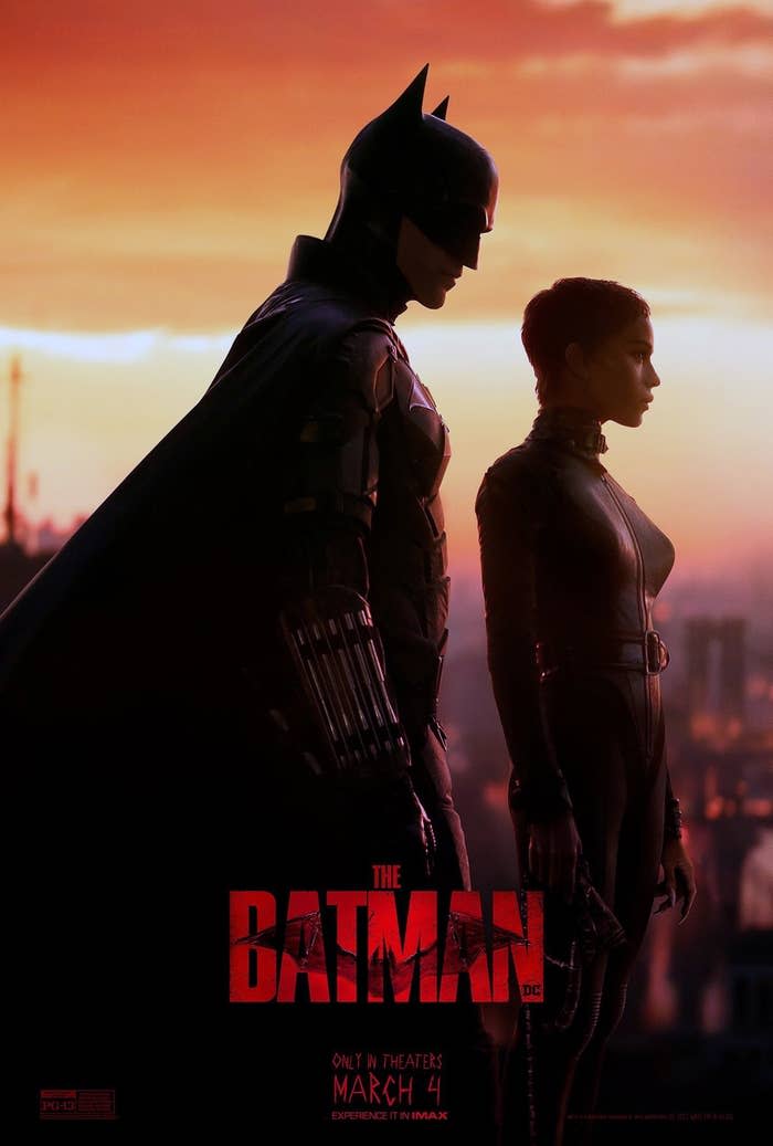 A promo photo for The Batman featuring Zoë as Selina standing slightly in front of Robert Pattinson's Batman