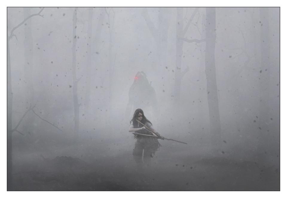 A hazy, misty forest with a Comanche warrior with a bow and arrow and behind them is the silhouette of a Predator with a glowing red eye piece in the upcoming Predator prequel Prey.